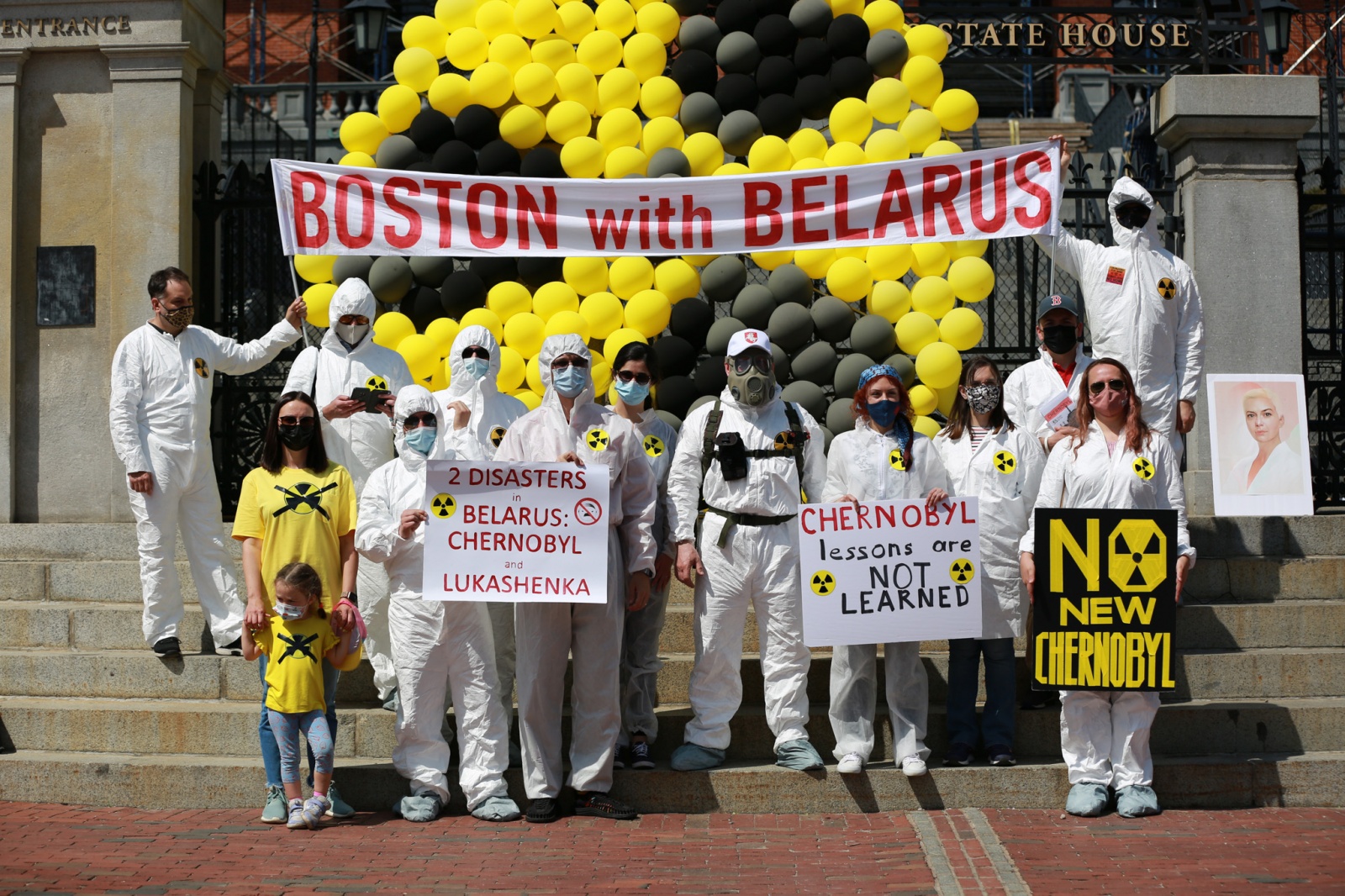 Chernobyl Rally - participants at State House with a trefoil sign 4-24-2021.jpg