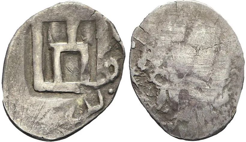 Усходняя манета з контрмаркай у выглядзе калюмнаў.jpg Усходняя манета з контрмаркай у выглядзе калюмнаў.jpg